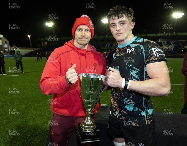 120226 - Cardiff Rugby U18 v Ospreys U18, WRU Regional Age Grade Championship Final - Wales U20 head coach Richard Whiffin presents Sam Morgan of Ospreys with the trophy