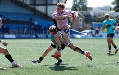 230826 - Cardiff Rugby U18 v Ospreys U18, WRU Regional Age Grade Championship - Liam Williams of Cardiff Rugby is tackled just short of the line