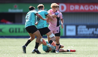 230826 - Cardiff Rugby U18 v Ospreys U18, WRU Regional Age Grade Championship - Iestyn Stephens of Cardiff Rugby is tackled