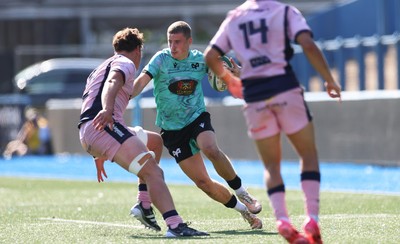 230826 - Cardiff Rugby U18 v Ospreys U18, WRU Regional Age Grade Championship - Dylan Quin of Ospreys takes on Alex Ballinger of Cardiff Rugby