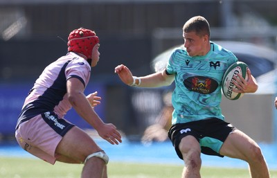 230826 - Cardiff Rugby U18 v Ospreys U18, WRU Regional Age Grade Championship - Dylan Quin of Ospreys takes on Alex Ballinger of Cardiff Rugby