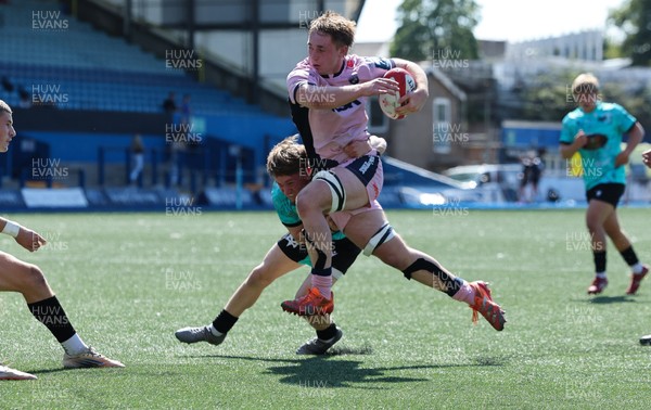 230826 - Cardiff Rugby U18 v Ospreys U18, WRU Regional Age Grade Championship - Liam Williams of Cardiff Rugby is tackled just short of the line