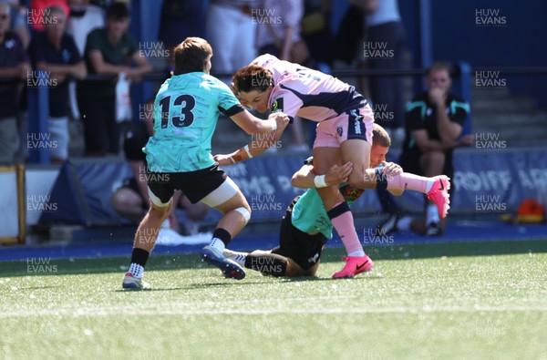 230826 - Cardiff Rugby U18 v Ospreys U18, WRU Regional Age Grade Championship - Devon Morris of Cardiff Rugby is tackled