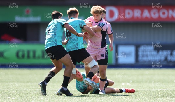 230826 - Cardiff Rugby U18 v Ospreys U18, WRU Regional Age Grade Championship - Iestyn Stephens of Cardiff Rugby is tackled