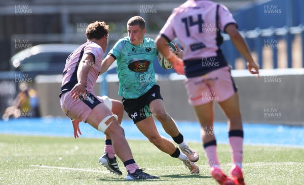 230826 - Cardiff Rugby U18 v Ospreys U18, WRU Regional Age Grade Championship - Dylan Quin of Ospreys takes on Alex Ballinger of Cardiff Rugby