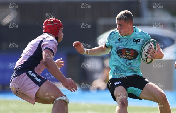 230826 - Cardiff Rugby U18 v Ospreys U18, WRU Regional Age Grade Championship - Dylan Quin of Ospreys takes on Alex Ballinger of Cardiff Rugby