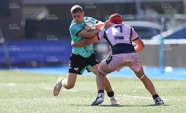 230826 - Cardiff Rugby U18 v Ospreys U18, WRU Regional Age Grade Championship - Dylan Quin of Ospreys takes on Alex Ballinger of Cardiff Rugby