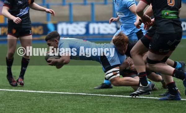 230122 - Cardiff Rugby U18 v RGC U18, Regional Age Grade Championship - Kian Evans of Cardiff Rugby powers over to score the opening try