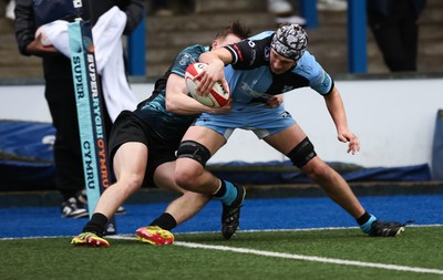 230225  Cardiff Rugby U18s v Ospreys U18s, WQRU Regional Age Grade Championship Final - Gabe Williams of Cardiff Rugby beats Noah Mason of Ospreys as he races in to score try