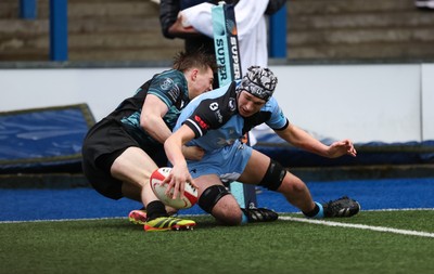 230225  Cardiff Rugby U18s v Ospreys U18s, WQRU Regional Age Grade Championship Final - Gabe Williams of Cardiff Rugby beats Noah Mason of Ospreys as he races in to score try