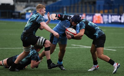 230225  Cardiff Rugby U18s v Ospreys U18s, WRU Regional Age Grade Championship Final - Tom Howe of Cardiff Rugby is held