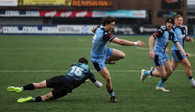 230225  Cardiff Rugby U18s v Ospreys U18s, WRU Regional Age Grade Championship Final - Ioan Penry of Cardiff Rugby beats Cian Evans of Ospreys as he races in to score try