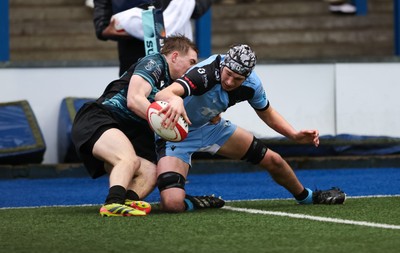 230225  Cardiff Rugby U18s v Ospreys U18s, WQRU Regional Age Grade Championship Final - Gabe Williams of Cardiff Rugby beats Noah Mason of Ospreys as he races in to score try