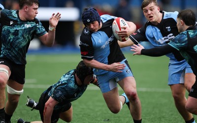 230225  Cardiff Rugby U18s v Ospreys U18s, WRU Regional Age Grade Championship Final - Tom Howe of Cardiff Rugby takes on Thomas Edwards of Ospreys