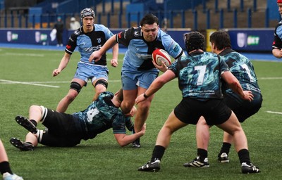 230225  Cardiff Rugby U18s v Ospreys U18s, WRU Regional Age Grade Championship Final - Ioan Dacey of Cardiff Rugby is tackled as he charges for the line