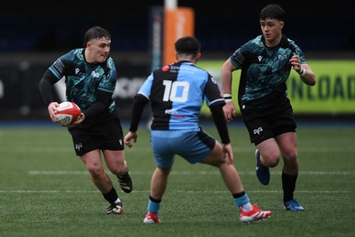 230225 - Cardiff Rugby U18s v Ospreys U18s - Regional Age-Grade Championship finals - Logan Jones of Ospreys U18s is challenged by Ben Coomer of Cardiff Rugby