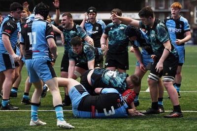 230225 - Cardiff Rugby U18s v Ospreys U18s - Regional Age-Grade Championship finals - Thomas Edwards of Ospreys U18s scores a try