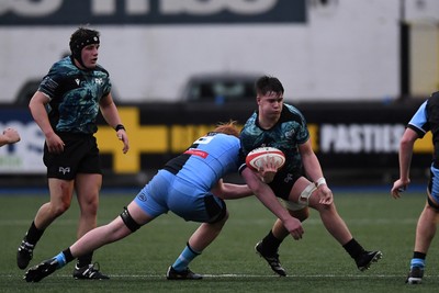 230225 - Cardiff Rugby U18s v Ospreys U18s - Regional Age-Grade Championship finals - Elis Cox of Ospreys U18s is challenged by Ioan Dacey of Cardiff Rugby