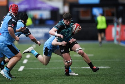 230225 - Cardiff Rugby U18s v Ospreys U18s - Regional Age-Grade Championship finals - Sam Morgan of Ospreys U18s is challenged by Rhys Cummings of Cardiff Rugby