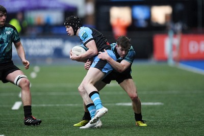 230225 - Cardiff Rugby U18s v Ospreys U18s - Regional Age-Grade Championship finals - Noah Mason of Ospreys U18s is challenged by Rhys Cummings of Cardiff Rugby