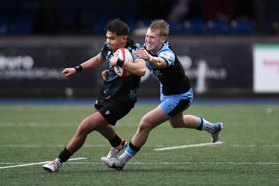 230225 - Cardiff Rugby U18s v Ospreys U18s - Regional Age-Grade Championship finals - Caelan Carson-Jones of Ospreys U18s is challenged by Mason Daniels of Cardiff Rugby