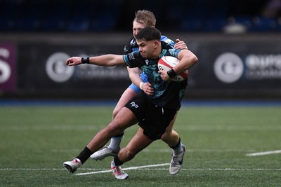 230225 - Cardiff Rugby U18s v Ospreys U18s - Regional Age-Grade Championship finals - Caelan Carson-Jones of Ospreys U18s is challenged by Mason Daniels of Cardiff Rugby