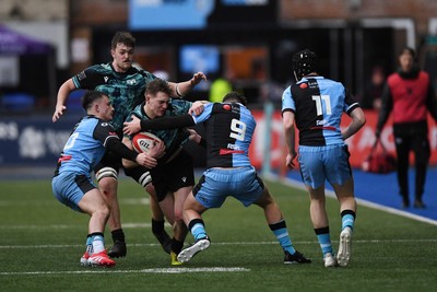 230225 - Cardiff Rugby U18s v Ospreys U18s - Regional Age-Grade Championship finals - Noah Mason of Ospreys U18s is challenged by Mason Daniels of Cardiff Rugby