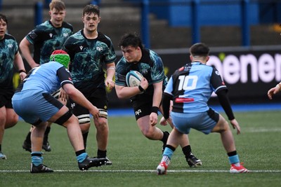 230225 - Cardiff Rugby U18s v Ospreys U18s - Regional Age-Grade Championship finals - Logan Jones of Ospreys U18s is challenged by Ben Coomer of Cardiff Rugby