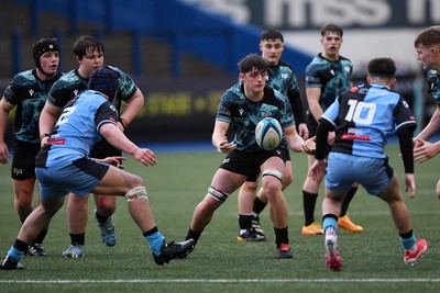 230225 - Cardiff Rugby U18s v Ospreys U18s - Regional Age-Grade Championship finals - Sam Morgan of Ospreys U18s is challenged by Ben Coomer of Cardiff Rugby