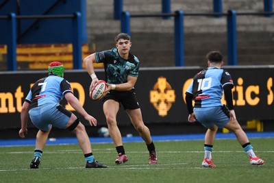 230225 - Cardiff Rugby U18s v Ospreys U18s - Regional Age-Grade Championship finals - Jack Hoskins of Ospreys U18s is challenged by Ben Coomer of Cardiff Rugby