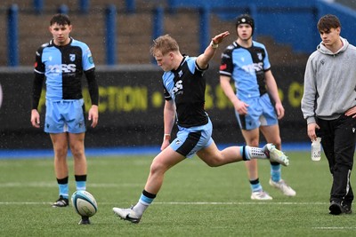 230225 - Cardiff Rugby U18s v Ospreys U18s - Regional Age-Grade Championship finals - Lloyd Lucas of Cardiff Rugby kicks a penalty