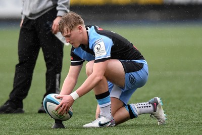 230225 - Cardiff Rugby U18s v Ospreys U18s - Regional Age-Grade Championship finals - Lloyd Lucas of Cardiff Rugby kicks a penalty