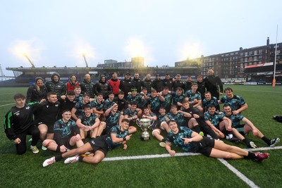 230225 - Cardiff Rugby U18s v Ospreys U18s - Regional Age-Grade Championship finals - Ospreys players celebrate with the trophy at full time