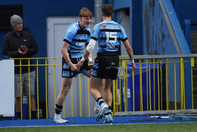 310825 - Cardiff Rugby U18s v RGC U18s - Calen Edwards of Cardiff celebrates scoring a try with team mates