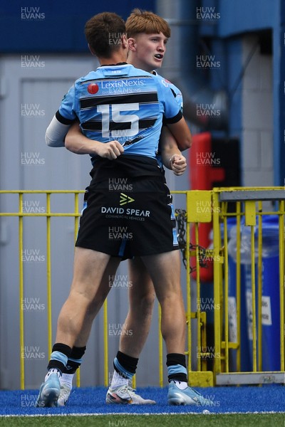 310825 - Cardiff Rugby U18s v RGC U18s - Calen Edwards of Cardiff celebrates scoring a try with team mates