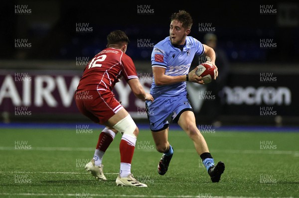 191222 - Cardiff Rugby U18s v Scarlets U18s - Regional Age Grade - Kyan Lewis of Cardiff is challenged by James Price of Scarlets 