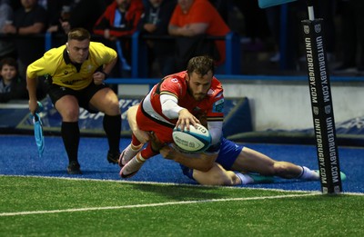 060924 - Cardiff Rugby v Bath Rugby, Pre-season Friendly - Iwan Stephens of Cardiff Rugby beats Austin Emens of Bath Rugby to score try