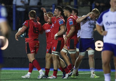 060924 - Cardiff Rugby v Bath Rugby, Pre-season Friendly - Daf Hughes of Cardiff Rugby is congratulated by team mates after he powers over to score try