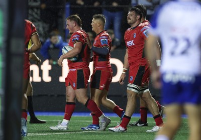 060924 - Cardiff Rugby v Bath Rugby, Pre-season Friendly - Daf Hughes of Cardiff Rugby is congratulated by team mates after he powers over to score try