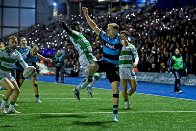 240126 - Cardiff Rugby v Benetton Rugby - United Rugby Championship - Aled Davies of Cardiff Rugby is challenged by Rhyno Smith of Benetton whilst Cardiff fans shine their phone lights in protest in the 11th minute due to the potential changes to Welsh Rugby 