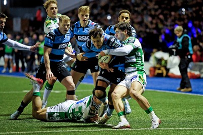 240126 - Cardiff Rugby v Benetton Rugby - United Rugby Championship - Iwan Stephens of Cardiff Rugby is challenged by Lorenzo Cannone of Benetton