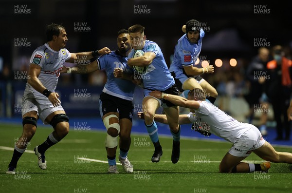161021 - Cardiff Rugby v Cell C Sharks - United Rugby Championship - Josh Adams of Cardiff is tackled by Marnus Potgieter and Henco Venter of Sharks