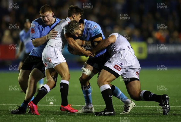 161021 - Cardiff Rugby v Cell C Sharks - United Rugby Championship - Josh Turnbull of Cardiff is tackled by Tian Meyer and Thomas du Toit of Sharks