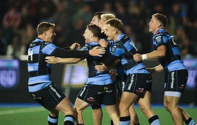 111025 - Cardiff Rugby v Connacht Rugby, United Rugby Championship - Cardiff celebrate with Tom Bowen of Cardiff Rugby after he dives in to score try