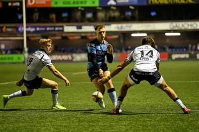111025 - Cardiff Rugby v Connacht - United Rugby Championship - Cam Winnett of Cardiff Rugby is challenged by Chay Mullins of Connacht