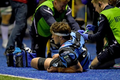 111025 - Cardiff Rugby v Connacht - United Rugby Championship - Teddy Williams of Cardiff Rugby receives treatment on the side of the pitch before being taken off in a stretcher