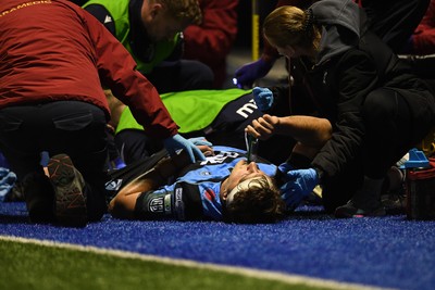 111025 - Cardiff Rugby v Connacht - United Rugby Championship - Teddy Williams of Cardiff Rugby receives treatment on the side of the pitch before being taken off in a stretcher