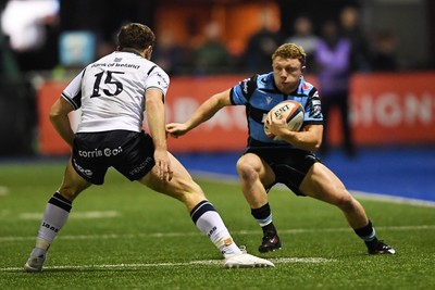 111025 - Cardiff Rugby v Connacht - United Rugby Championship - Tom Bowen of Cardiff Rugby is challenged by Sean Naughton of Connacht