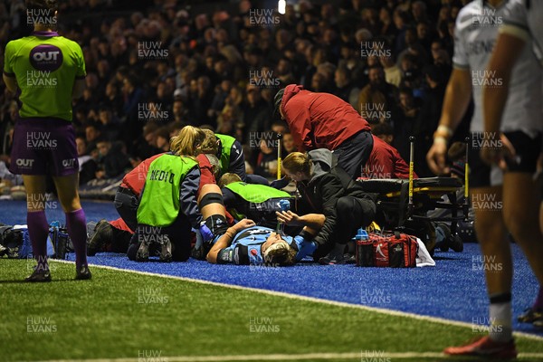 111025 - Cardiff Rugby v Connacht - United Rugby Championship - Teddy Williams of Cardiff Rugby receives treatment on the side of the pitch before being taken off in a stretcher