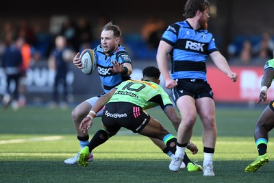 150526 - Cardiff Rugby v DHL Stormers - United Rugby Championship - Ioan Lloyd of Cardiff Rugby is challenged by Sacha Feinberg-Mngomezulu of Stormers